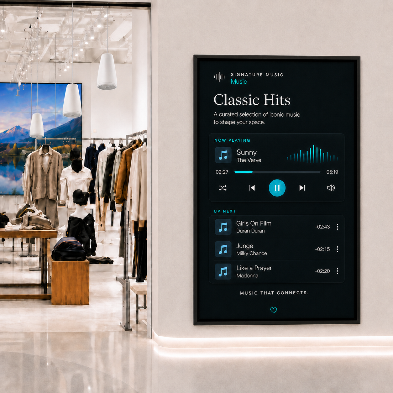 Retail store with white Bose loudspeakers and a music display, with visible wall space above the frame